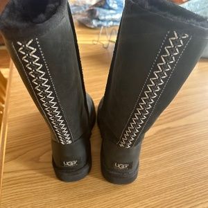 Ugg tall black boot, with braid detail